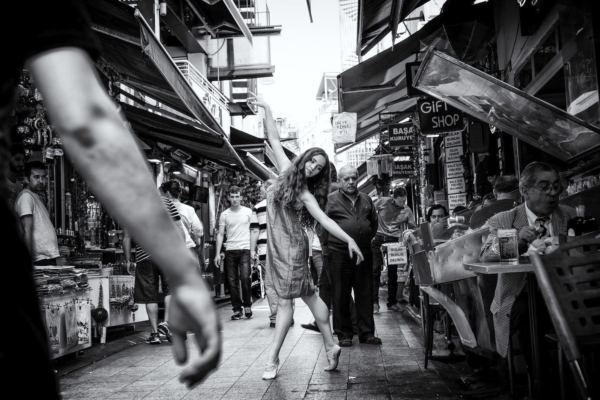 In Haste, a dancer performing in a crowded Istanbul market street
